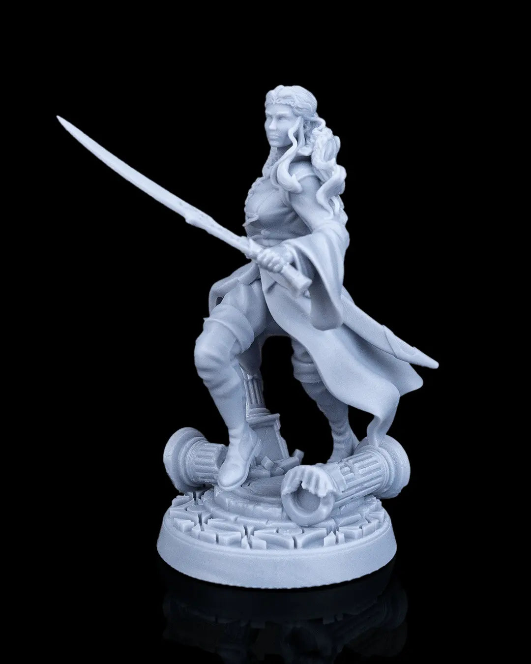 Side angled view of Aurelia the Savior human hero female resin miniature showing her duster coat and ruins base.