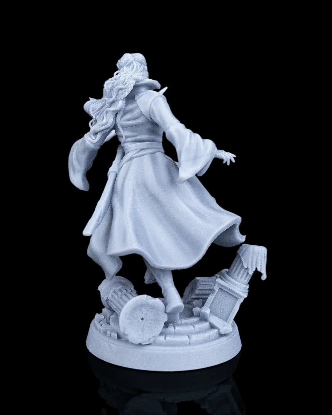 Rear view of Aurelia the Savior human fighter miniature showing the back of her flowing duster coat.