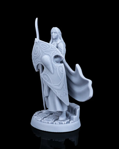 Front right angled view of the Bastion Female Elf Warrior miniature showcasing her armored shoulder and detailed shield curves.