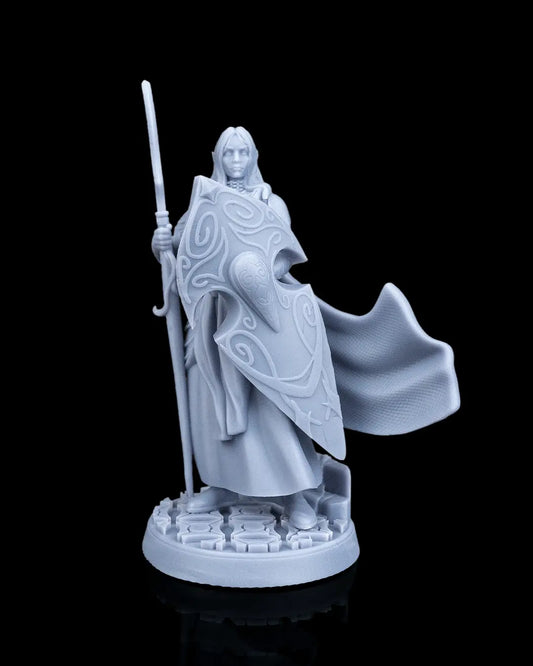 Bastion Female Elf Warrior 32mm scale resin miniature by Artificers Mini holding a spear and a large ornate elven shield.