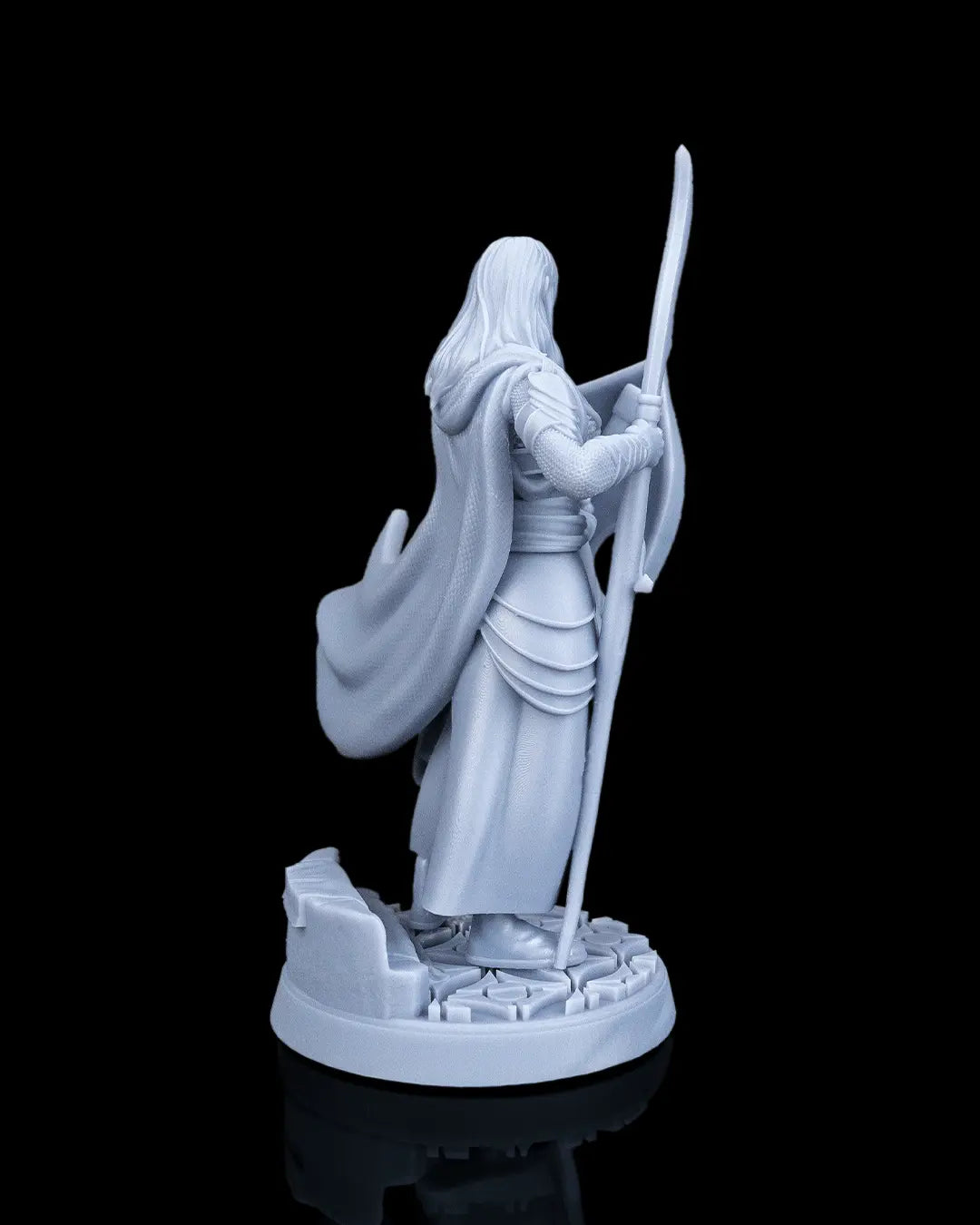 Rear right view of the Bastion Female Elf Warrior figurine showing the flowing cape texture and arm armor.