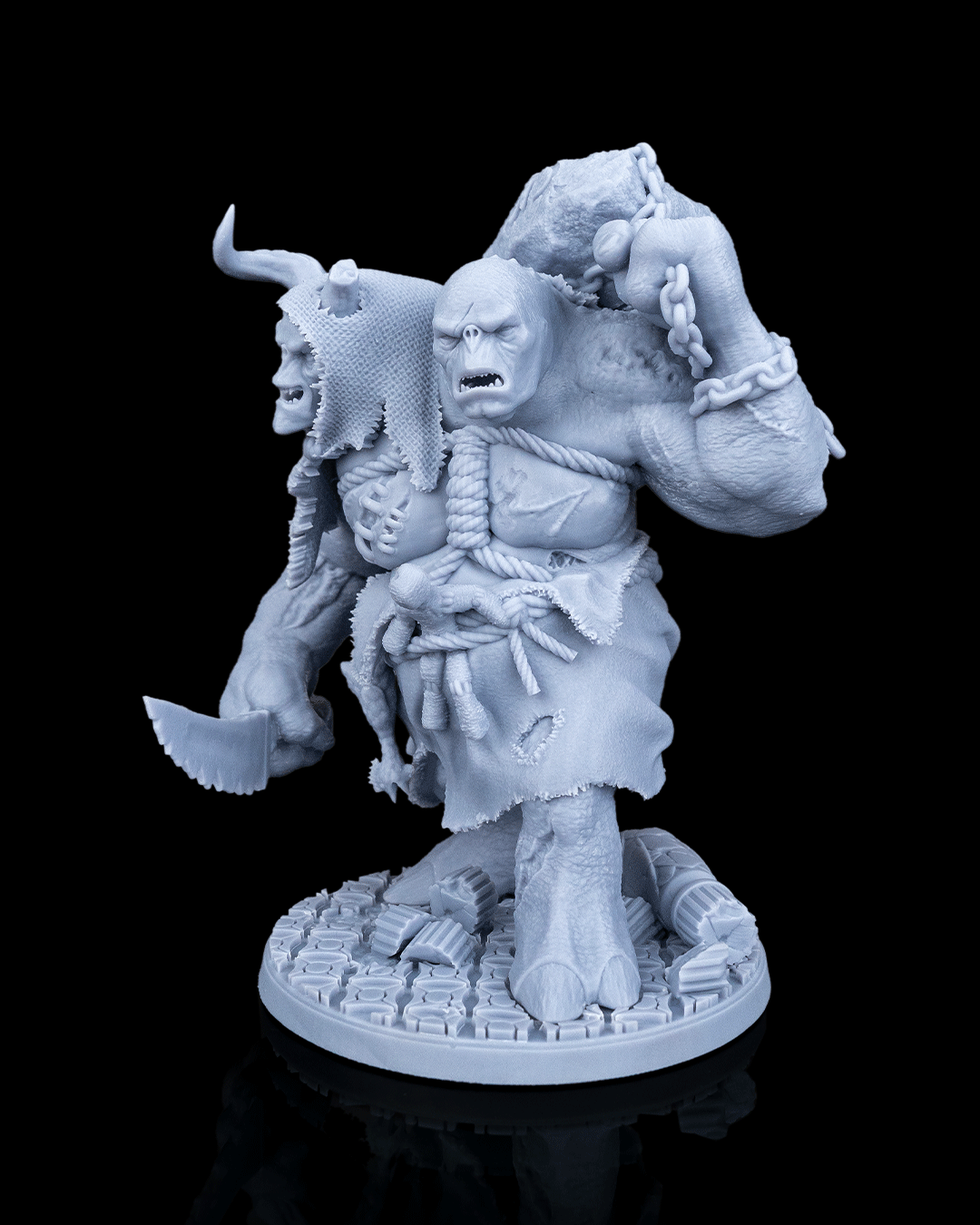 Three-quarter view of Brugtilda the Bloated miniature showcasing both monstrous heads and the chained boulder.