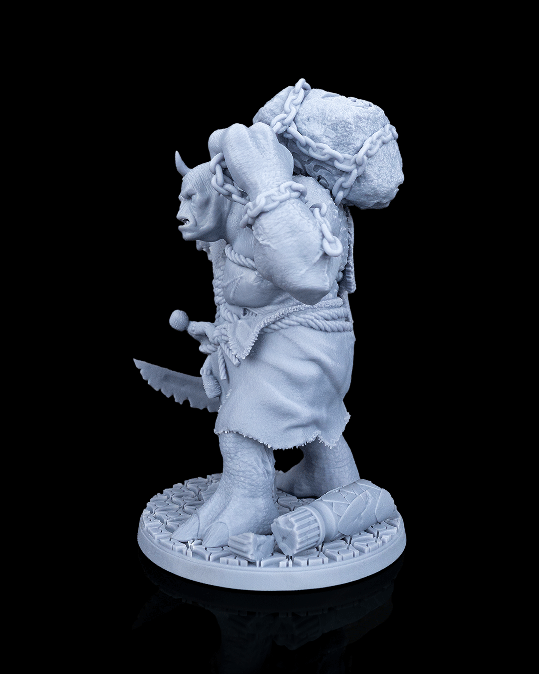 Left profile view of the Brugtilda the Bloated miniature emphasizing the massive chained boulder carried on her back.