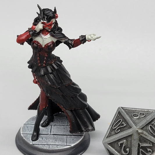 Commissioned paintwork by D&K Custom Prints of 32mm scale Carmine Duvall Vampire Bard miniature with visible fangs and elegant gothic attire.