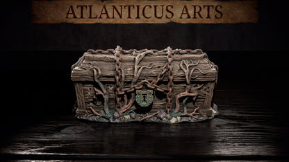 Wide shot of the painted resin Chained Coffin terrain piece resting on a dark, reflective wooden surface.
