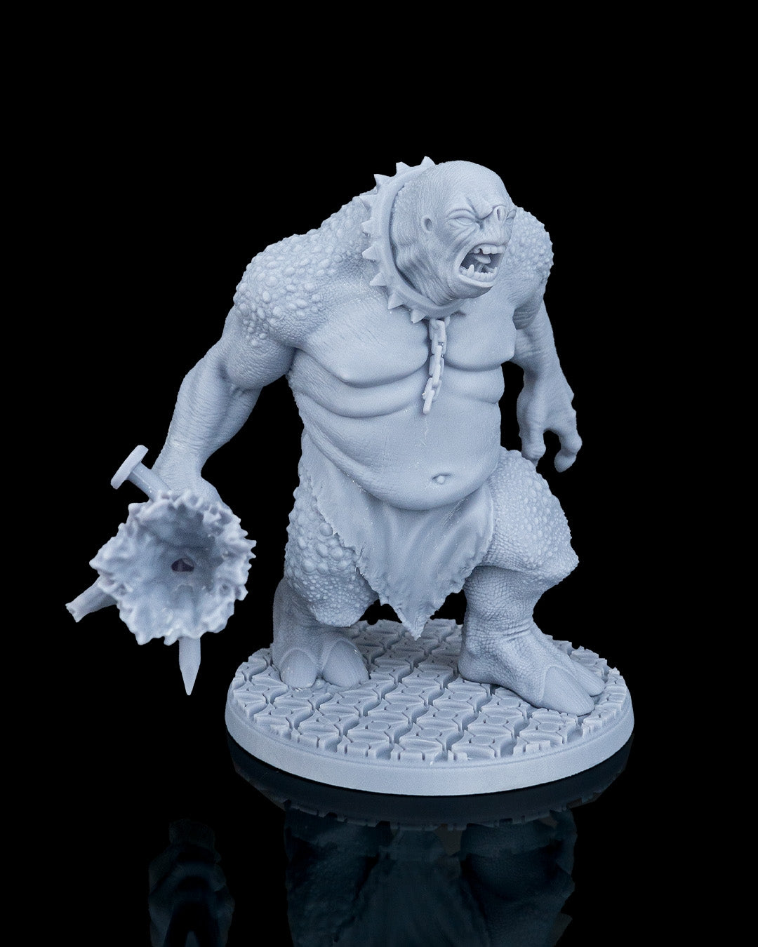 Three-quarter front view of Clubba the Troll mini showing his open-mouthed snarl and nail-studded tree club.