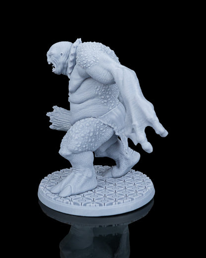 Left profile view of the Clubba the Troll dnd miniature showing his reaching claw and muscular posture.