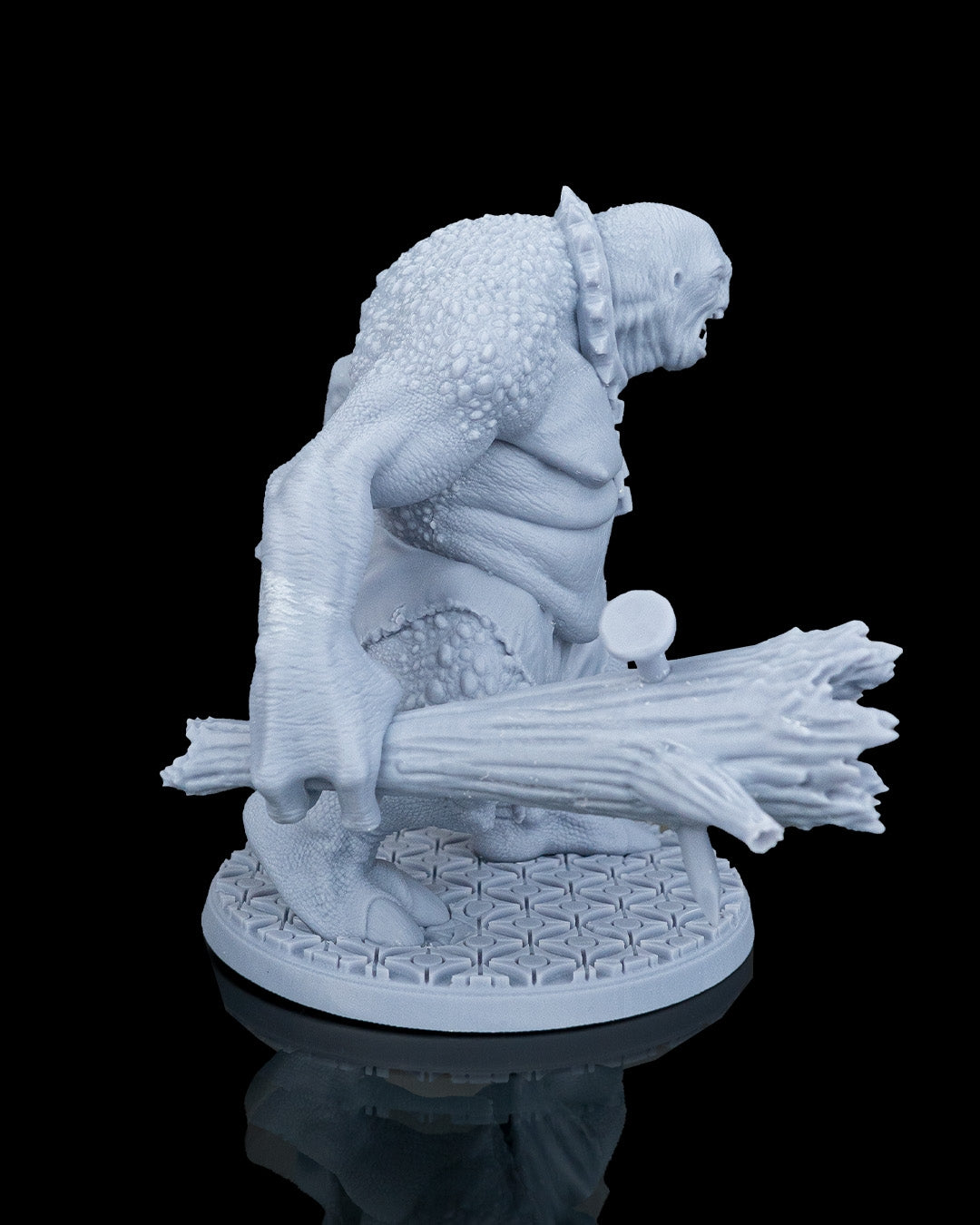Right side profile of Clubba the Troll miniature showing his hunched back texture and club length.