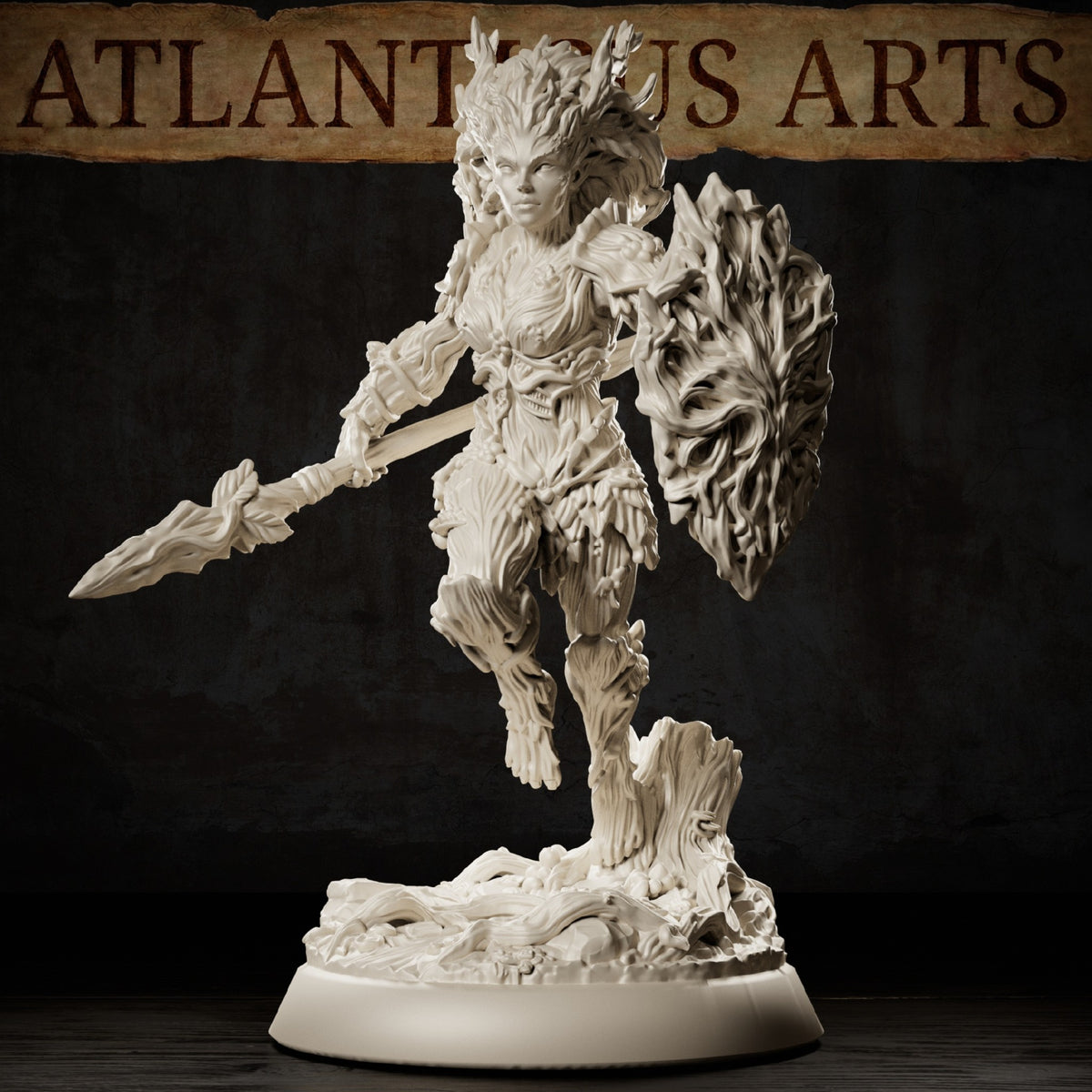 Dryad Warrior miniature wielding a long wooden spear and large living-wood shield with bark armor, branch-like hair, and forest scenic base.