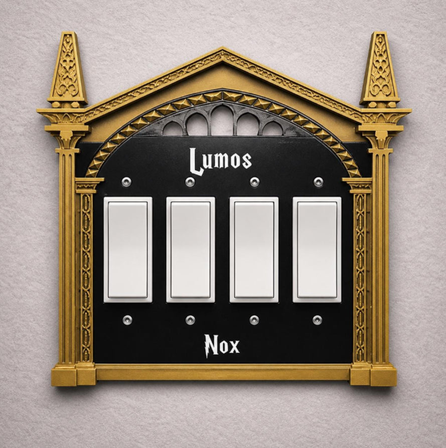4 gang rocker wizard light switch cover with bronze frame, and black plate with white letters decorative wall plate
