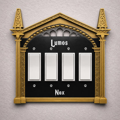 4 gang rocker wizard light switch cover with bronze frame, and black plate with white letters decorative wall plate