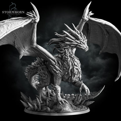 Right three-quarter view of the Gargantuan Frost Dragon resin miniature perched on an ice crystal base by Stormborn Collectibles.