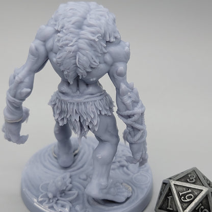 Rear view of unpainted Hag Cursed Troll 1 with empty hands, muscular arms, and ragged clothing.
