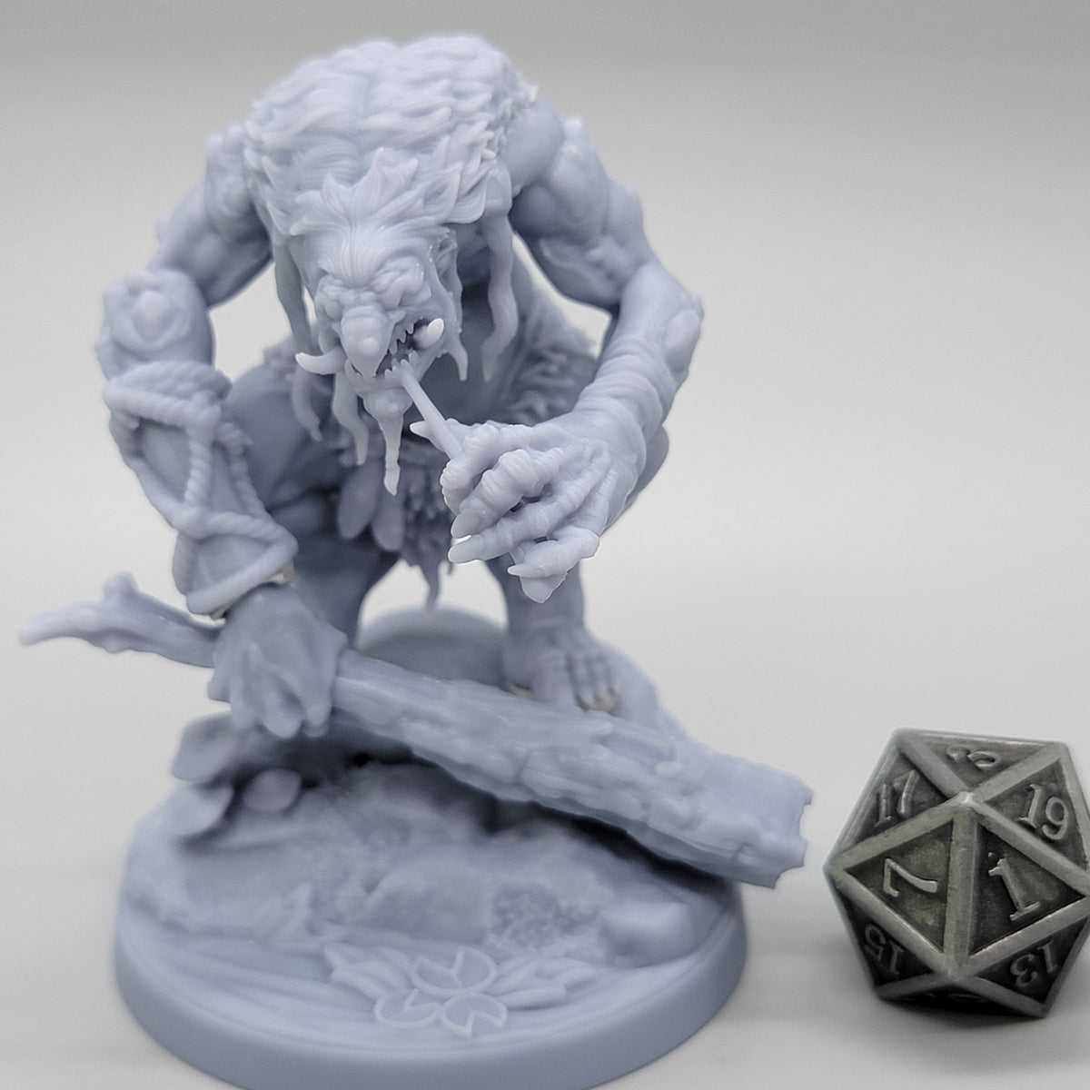 Unpainted Hag Cursed Troll 2 gripping a wooden club above a scenic base with a fallen log club.