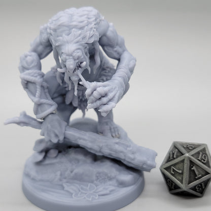 Unpainted Hag Cursed Troll 2 gripping a wooden club above a scenic base with a fallen log club.