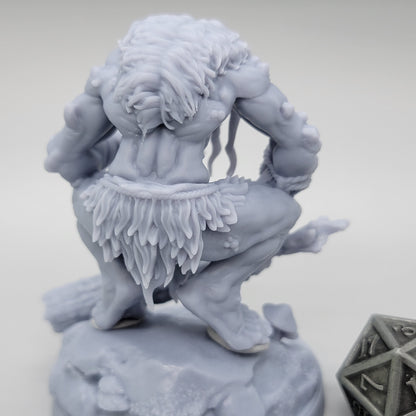 Rear view of unpainted Hag Cursed Troll 2 showing thick hair, muscular back, and layered ragged clothing.