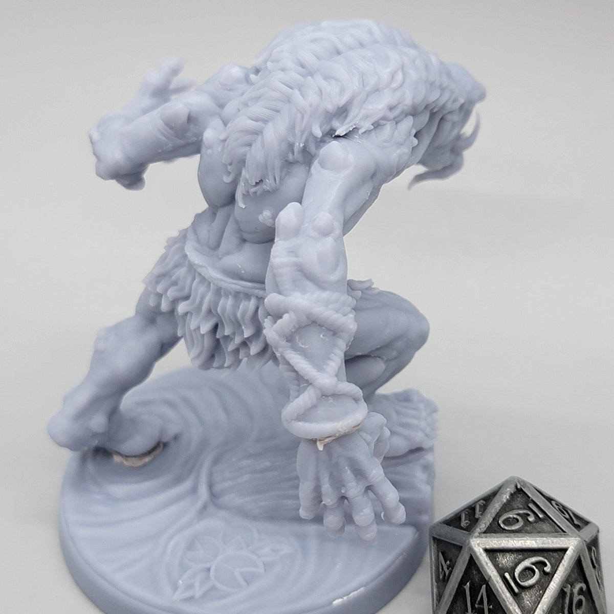 Rear angled view of unpainted Hag Cursed Troll 3 showing its leaning pose, extended arm, and scenic base.