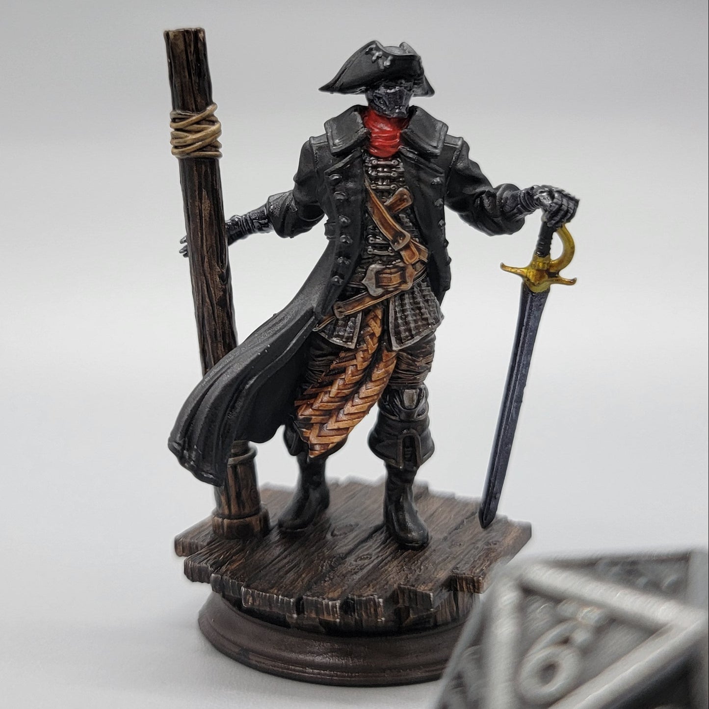 Painted Harvold Blue Eyes Stalson miniature with sword, dock base, and scale die for TTRPG games