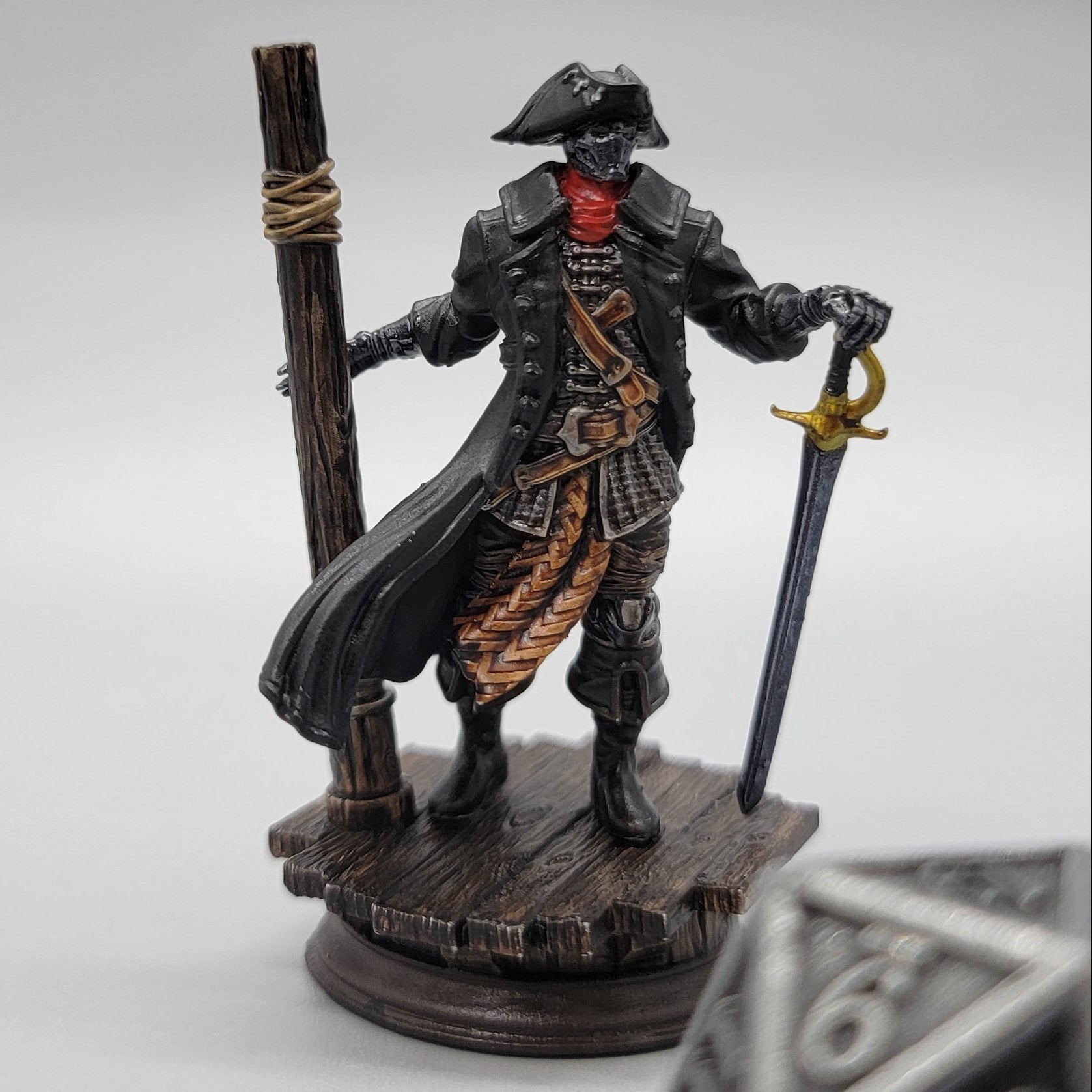 Painted Harvold Blue Eyes Stalson miniature with sword, dock base, and scale die for TTRPG games