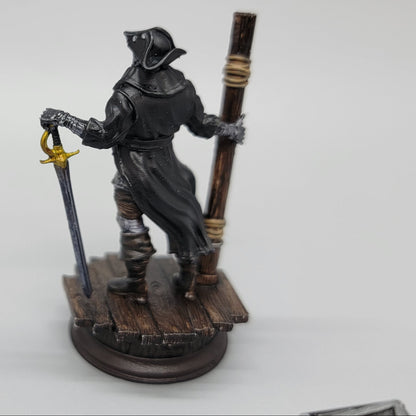 Back view of painted Harvold Stalson Soulforged Swashbuckler miniature with long coat and dock base