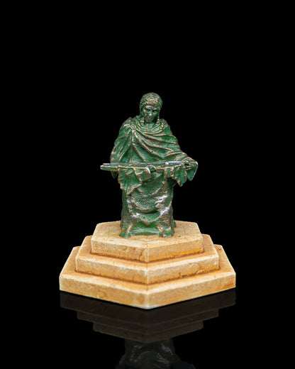A fantasy elven shrine miniature depicting a fallen king figure standing on a tiered hexagonal pedestal base.