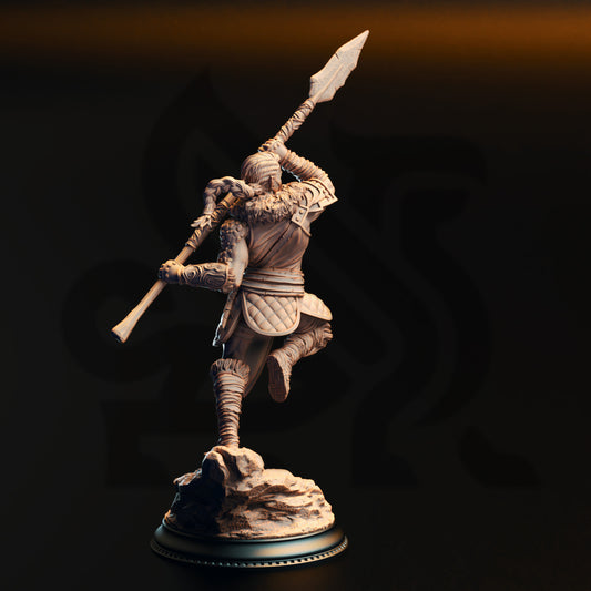 Rear render view of the Illyria Spineshatter Half-Dragon Female Barbarian miniature showing braided ponytail, fur collar, and quilted armor skirt.
