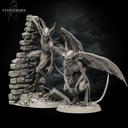 Angled render showing the depth, wing spans, and stone wall base details of the imp miniature set by Stormborn Collectibles.