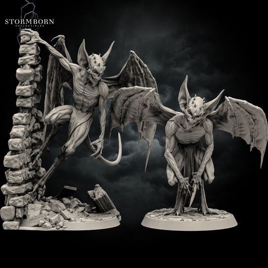 Front view render of two imp miniatures showing the wall-climbing pose on the left and crouching pose on the right by Stormborn Collectibles.