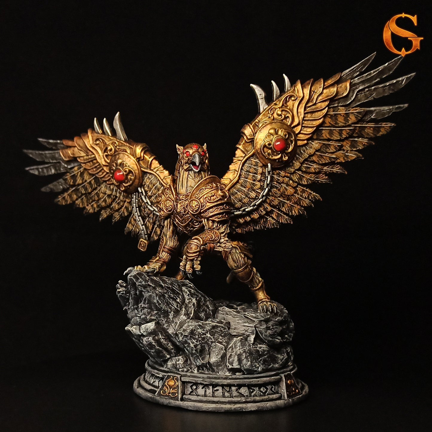 Render of what the painted resin model of Ironwing the Guardian with gold metallic armor, red gem accents, and dark realistic feathers could look like.