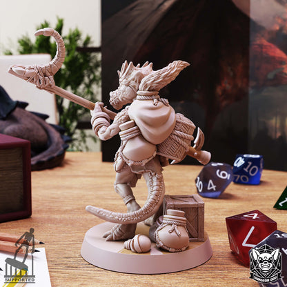 Rear view of Kobold Spurt Collector showing a textured backpack, hood, curved reptilian tail, and supply containers.