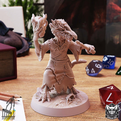 Alternate front view of Kobold Wizard holding a wand and magical effect, with stitched robes and a skull on the scenic base.