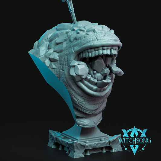 Lak, Eater of Rock 100mm display bust showing her enormous tooth-filled maw and rugged stone-covered hide.