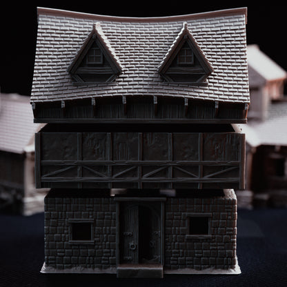 Exploded view of the multi-piece Hangman's Cottage showing separate floor and roof levels.