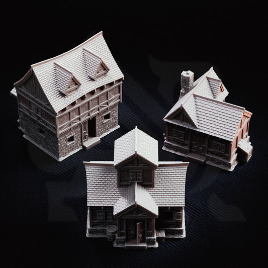 Overview render of the complete Limlight Village Terrain Set featuring three medieval fantasy PLA+ buildings on a dark background.