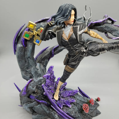 Close angle of hand painted Lune resin statue showing face, outfit, base, and purple details