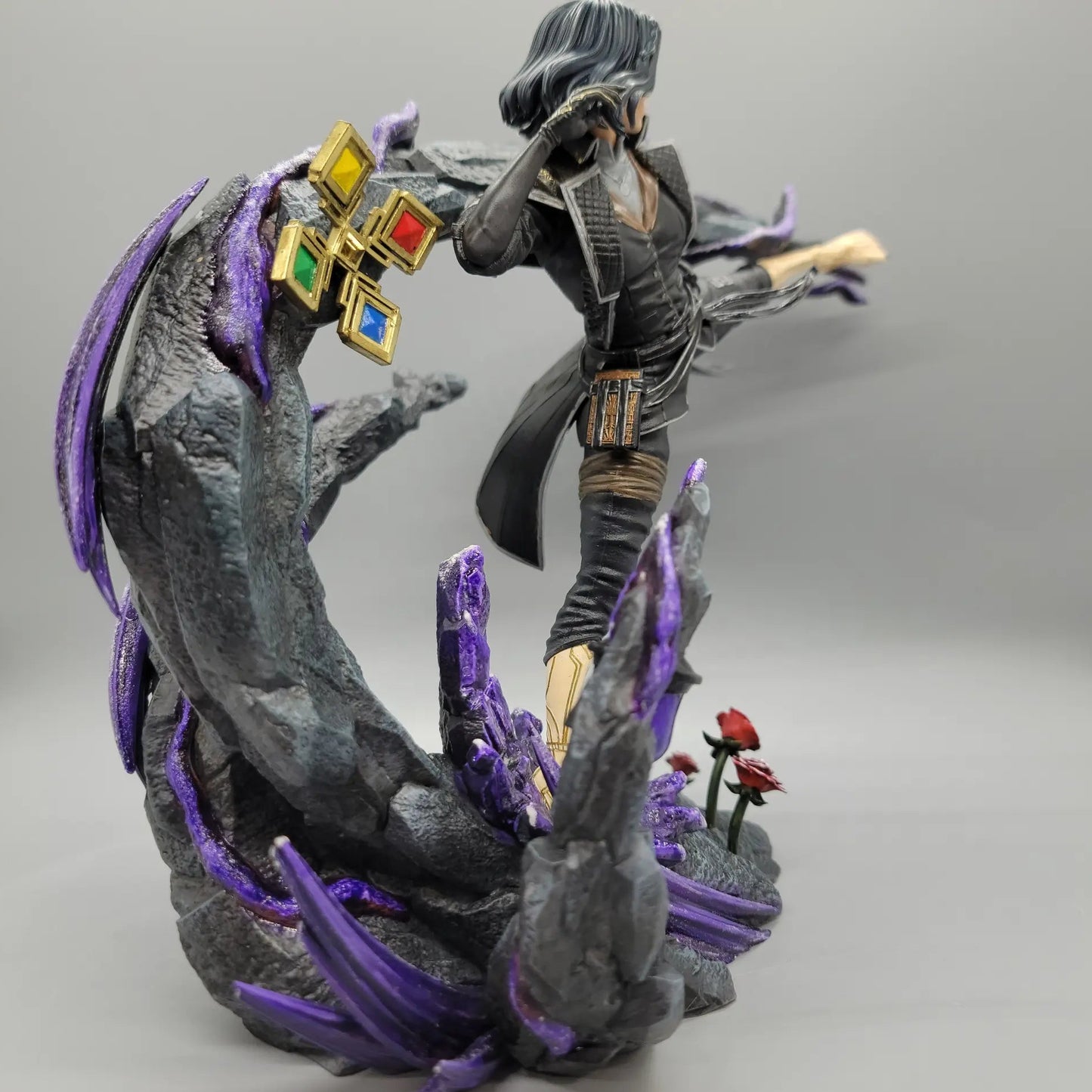Rear side view of painted Lune resin statue with detailed base and purple effects