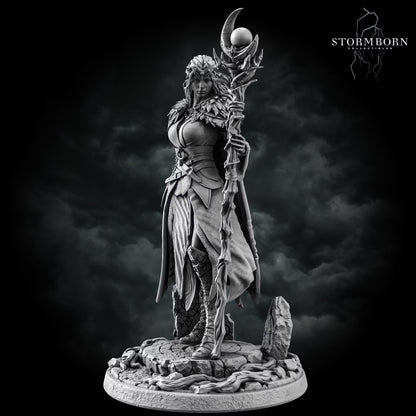 Front three-quarter view of Maelin holding her moon staff with detailed clothing and natural scenic elements around her feet.