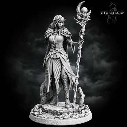 Maelin the elf druid holding a tall crescent moon staff while standing on a detailed woodland-style base.
