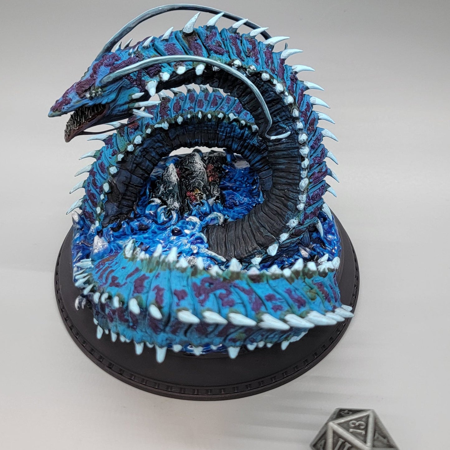 Angled view of painted Old Mawgrin gargantuan sea serpent miniature with detailed scales and fangs