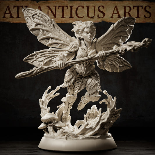 Pixie resin miniature flying above a woodland base with four patterned wings, twisted wooden staff, leaf clothing, mushrooms, and fallen tree details.