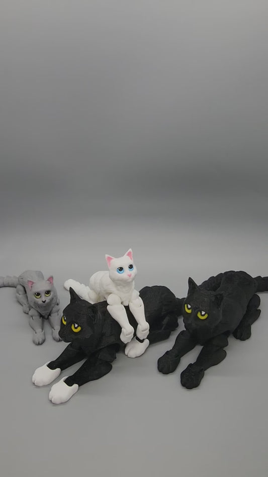 Showcase of 4 articulated cat minifigures, 2 are black & large with yellow eyes and the others are grey/white with yellow/blue eyes.
