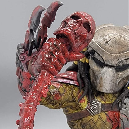 Predator Alien Hunter resin statue close-up of the skull trophy with fresh blood effect on it