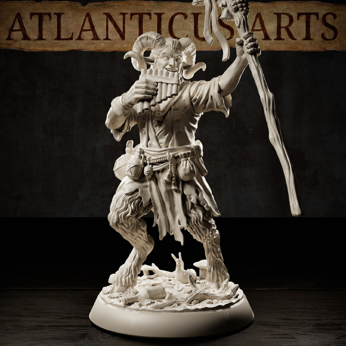 Satyr Revelmaster resin miniature with curling ram horns, panpipes, tall wooden staff, cloven hooves, pouches, and mushroom woodland base.