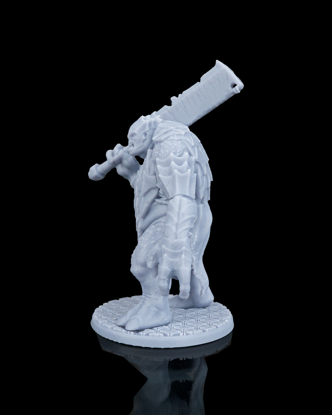 Left side profile of Slasha the Troll miniature showing his segmented shoulder guards and arm posture.