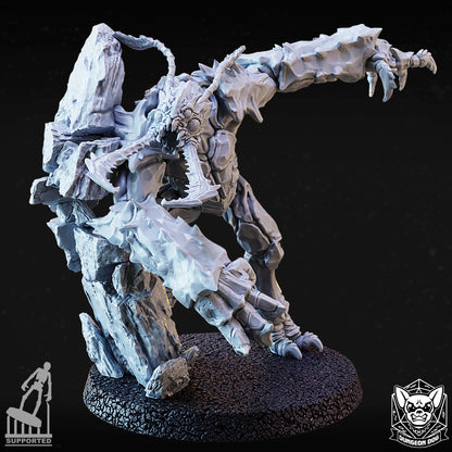 Front view of variant D resin monster miniature bursting dynamically through a stone cavern wall.