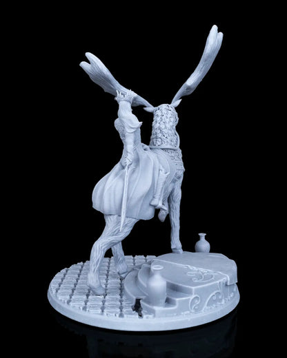 Full rear view of the mounted elven miniature showcasing the flowing fabric folds of the cloak and the back of the scenic stone base.