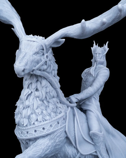 Close up macro detail of the unpainted resin elven rider with a crown and detailed facial features next to the giant elk's head.