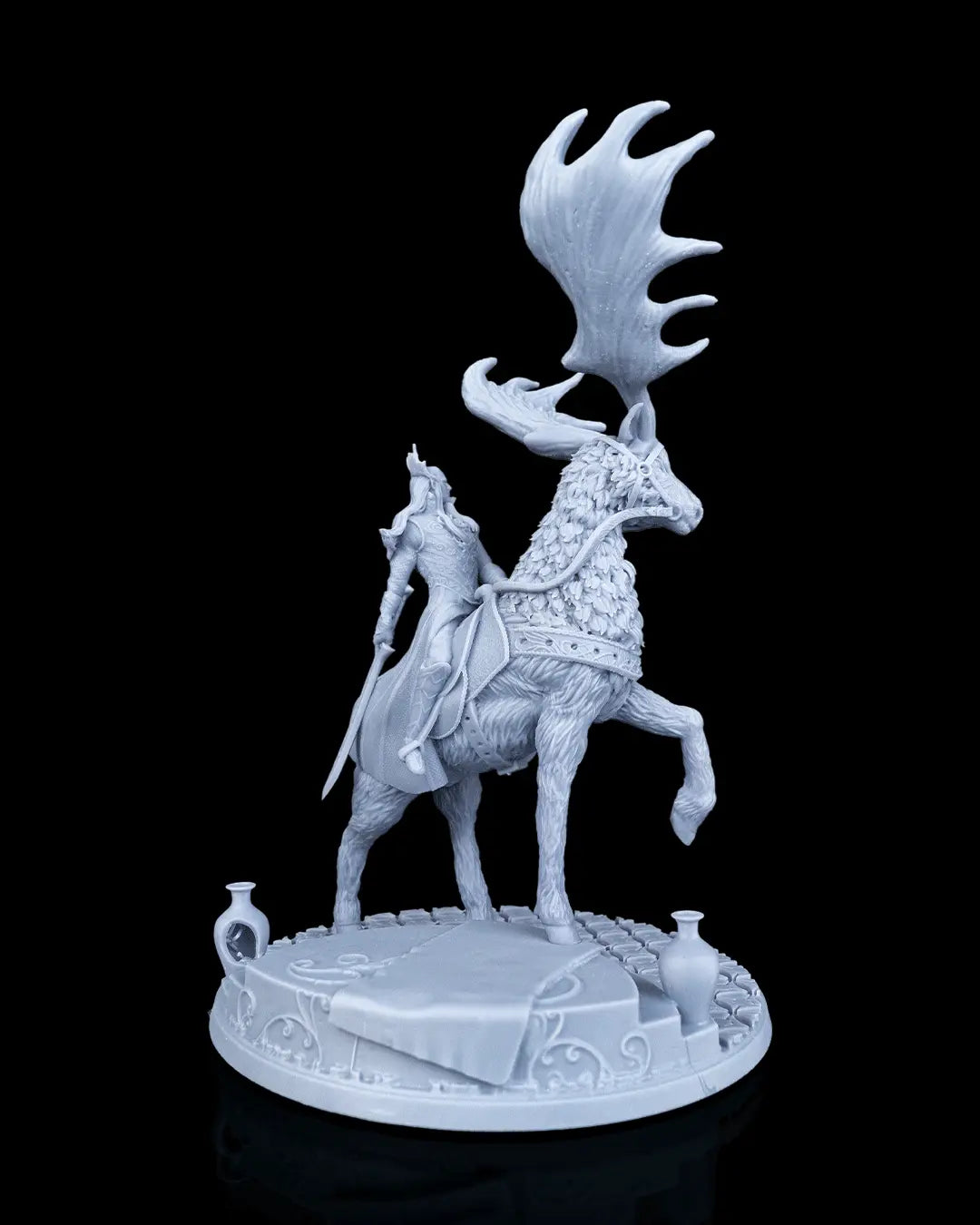 Right side view of the mounted elf miniature showing the huge sweeping elk antlers and the rider holding a long elven sword down at his side.