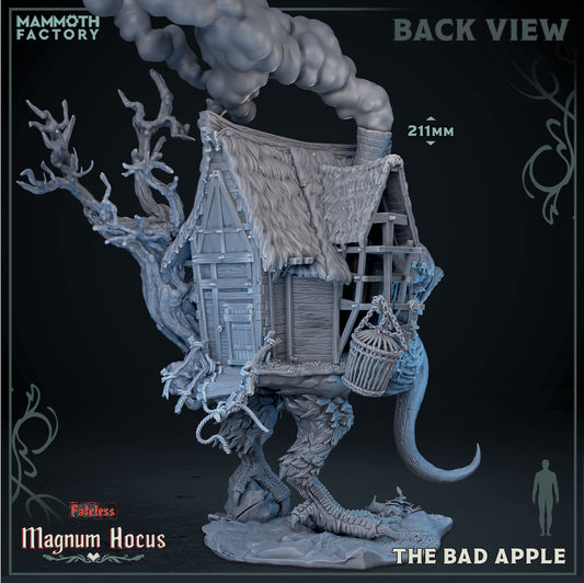 Back view of The Bad Apple walking hut resin miniature showing the detailed thatched roof chimney smoke and hanging cage accent.