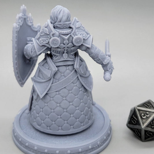Thyra Malenholt armored Human Barbarian miniature with layered plate, fur, sword, and shield.